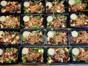 A week of chef-made meal prep containers lined up and ready for pickup